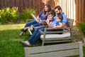 Sonny Johl ’02, M.B.A. ’10, and wife Anu, read stories to their children in the cool shade of their backyard.