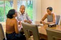 Gary May, chancellor, spends some quality family time playing a card game with wife LeShelle and daughter Simone.