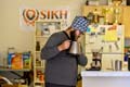 Gurmun Singh, Senior in Neurobiology, Physiology and Behavior, prepares coffee in his kitchen.